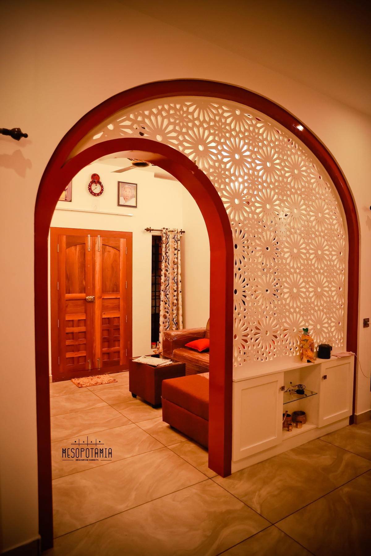 An arch and a cut screen opening a passage