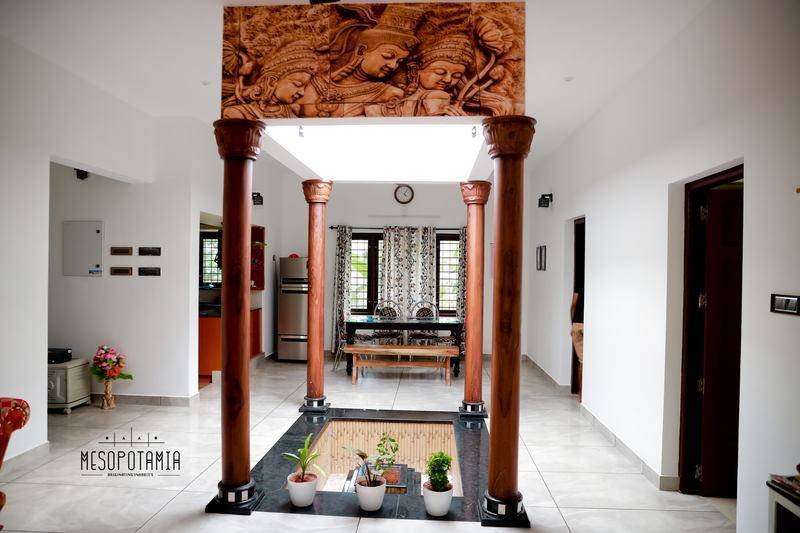 Looking across the court from the hall — one carved panel, and the rest left plain.