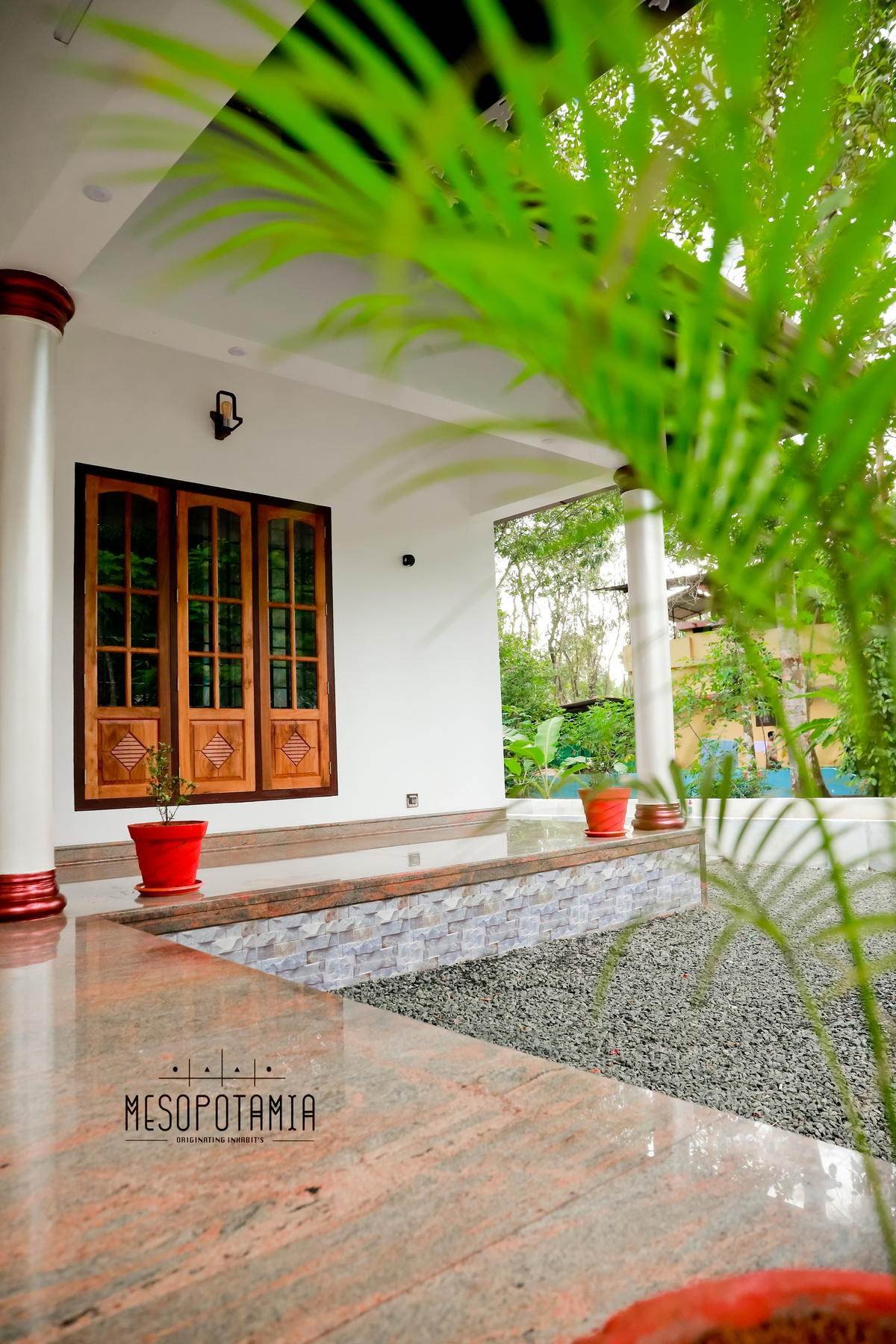 The verandah where it meets the garden.