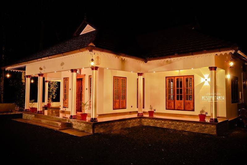 The long elevation at night. The roof line is deliberately lit.