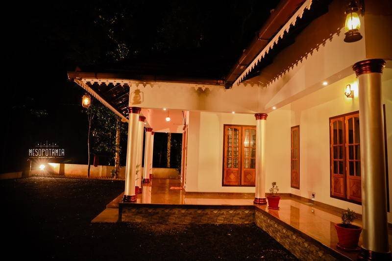 The entrance side after dark.
