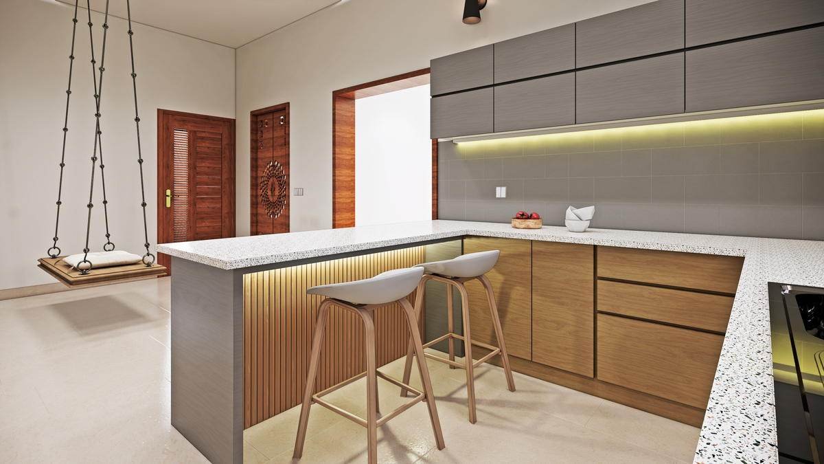 An island kitchen in timber and grey, open to the dining beyond